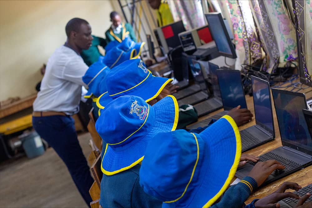 Computer students in a classroom during a practical lesson.